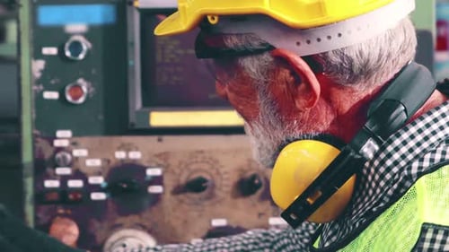 Senior Factory Worker Teach How to Use Machine Equipment in the Factory Workshop