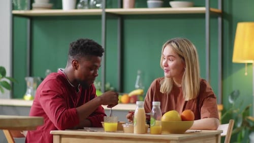 Couple Eating Breakfast Together in Kitchen