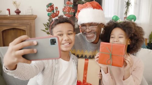 Christmas Family Selfie with Gifts and Antlers