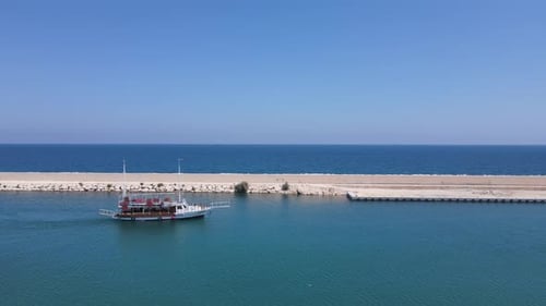 Boat Travels Through Calm Ocean Water
