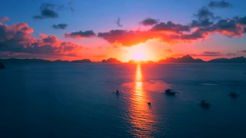 Boats Silhouette in the Sea on Sunset and Isles Background. Scenic Evening Sky Above Sea