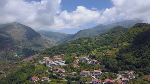Aerial Medieval Village on Cliff Overlooking Mountain Gorge, Old Italian Town During Sunny Day