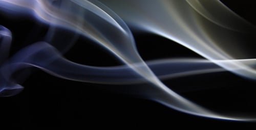 Swirling Smoke Patterns Against Black Background