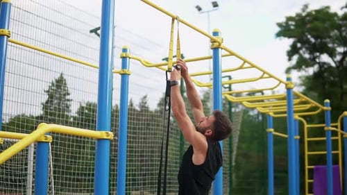 Fit Man Setting Up Exercise Bands Outdoors