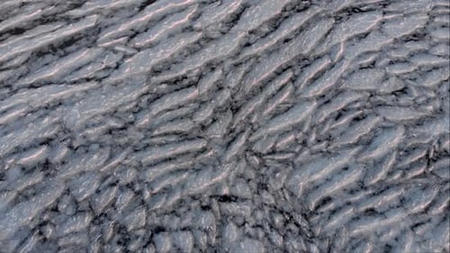 Aerial Fly Over View of Cracked Ice in the Sea