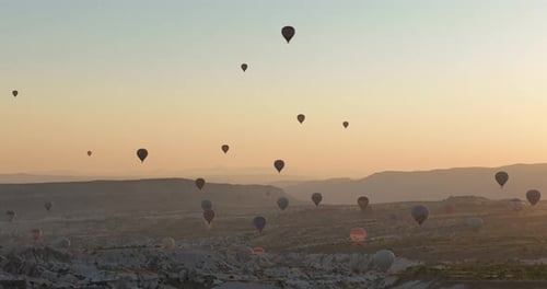 Aerial Cinematic Drone View of Colorful Hot Air Balloon Flying Over Cappadocia