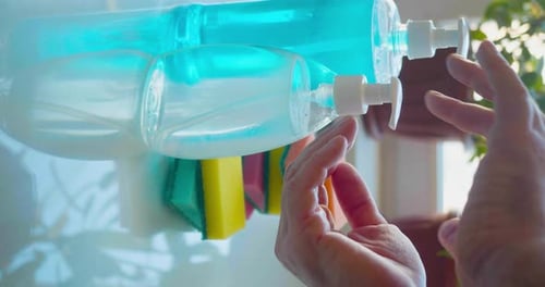 Cleaning Concept Detergents and Sponges for Washing Hand Picks Up Liquid Soap