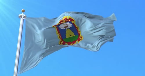 Waving Flag with Coat of Arms against Blue Sky