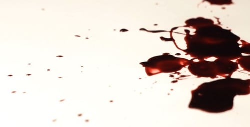 Red Liquid Dripping on White Surface