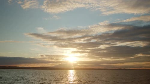 Beautiful Sunset with Clouds and Sea with Beach Time Lapse