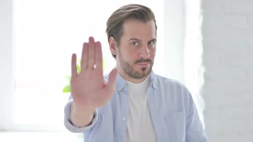 Adult Man Showing Stop Hand Gesture Close Up