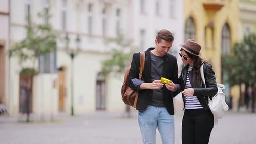 Couple Takes Selfie on City Street