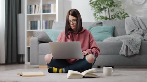Young Adult Working on Laptop at Home
