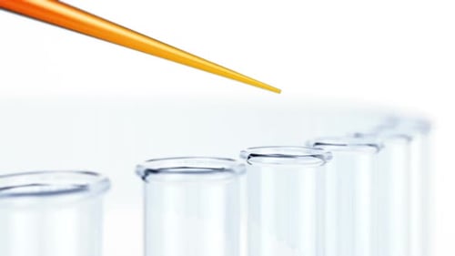 Pipette Dropping Liquid into Glass Test Tubes