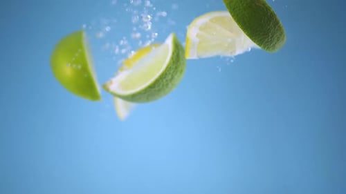 Citrus Fruit Slices Falling Through Water