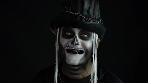 Man with Halloween Skeleton Face Makeup and Hat