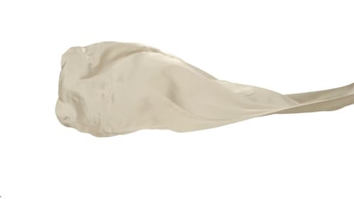 Beige Fabric Flowing on White Background