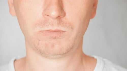 Close Up Face Fair Man Eating Eating Snack with Salt