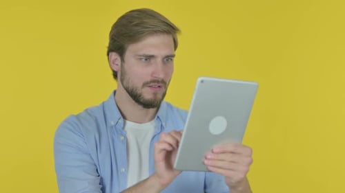 Man Uses Tablet, Reacts Negatively to the Screen