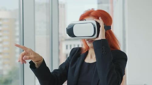 Woman Experiences Virtual Reality in Modern Office