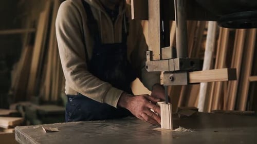 Slow Motion Footage of Carpenter Working with a Wood Block in Workshop