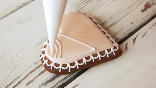 Decorating Heart Shaped Gingerbread Cookie with Icing