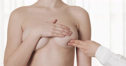 Doctor Checking Woman's Breast at Hospital