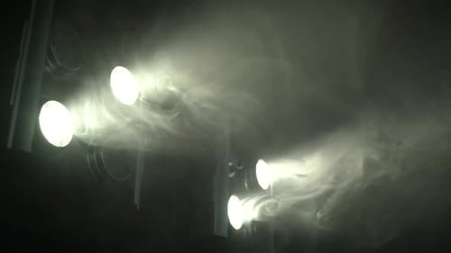 Stage Lights Beam Through Smoke Background
