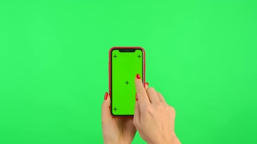 Woman Holds Mobile Phone with Workspace Mock Up Screen on Green Background