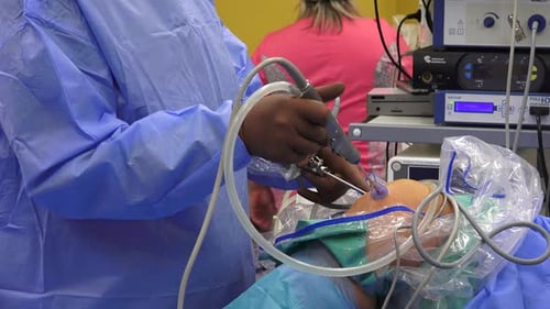 Surgeon Using Medical Instruments Performing Operation