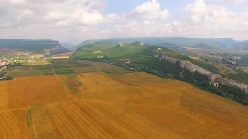 Panorama of the Field Stretching To the Mountains