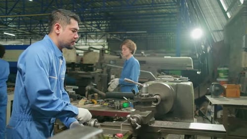 Professional workers teams work in the metalwork manufacturing factory.