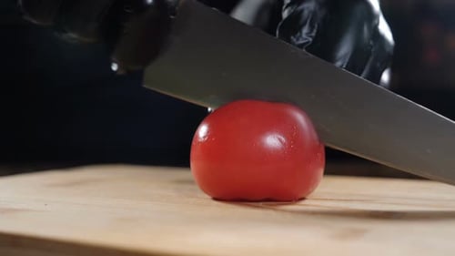Tomato Sliced on Wooden Cutting Board