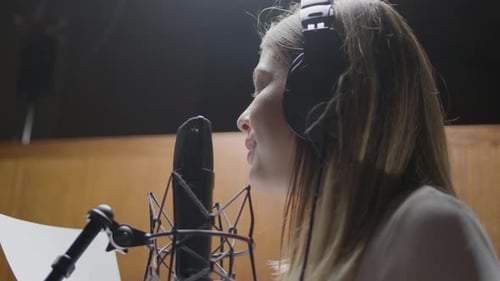 Beautiful Female Singer Working in Music Studio