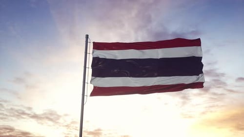 Waving Flag of Thailand Against Sunset Sky
