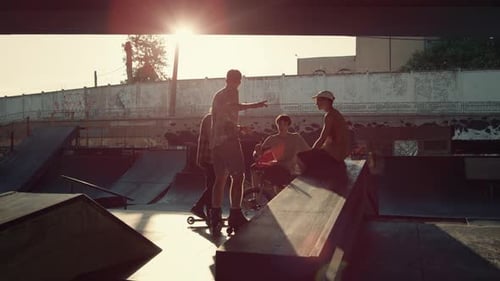 Young Guys Communicating in Skate Park