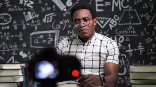 Close-up angry African American teacher talk in front of camera