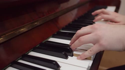 Female Hands Playing the Piano Closeup Side View