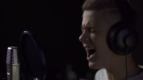 Boy Singing Into Studio Microphone