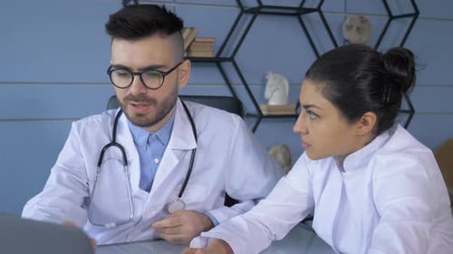 Close Up Medical doctors working in hospital office making computer research. Medicine