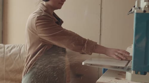 Young Woman Working in Carpentry Workshop