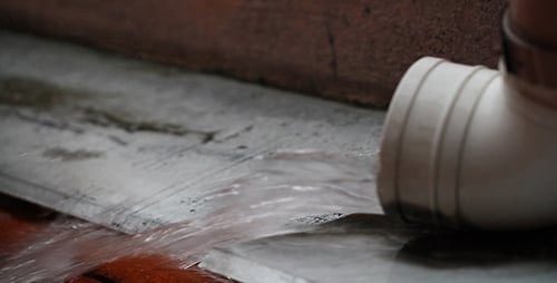 Water Flowing From White Plastic Pipe