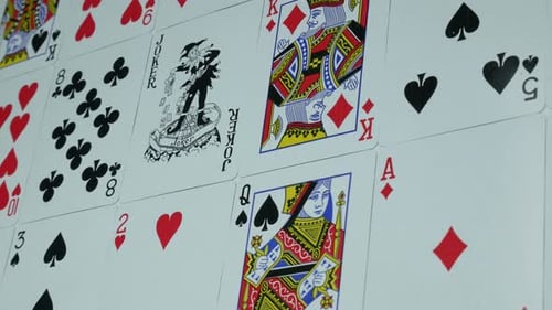 Playing Cards Arranged in Pattern with Joker