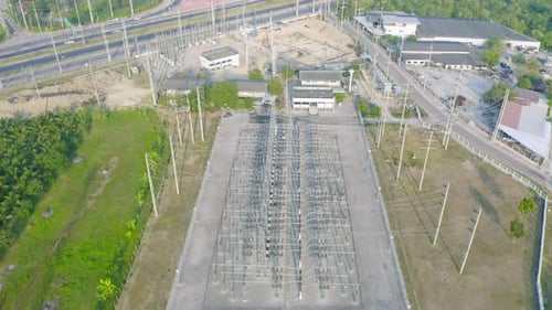 Aerial view of electricity generating, voltage poles. Power lines on utility tower and cable wires