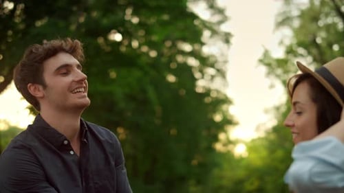 Excited Couple Jumping on Road Outdoors. Girl and Guy Having Fun on Nature