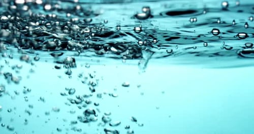 Bubbles Rising in Transparent Blue Water