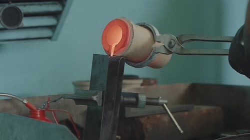 Molten Gold Being Poured Into Ingot Moulds