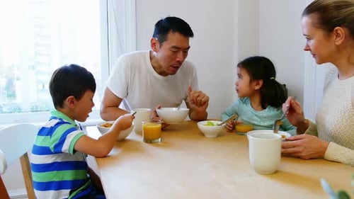 Family Together at Breakfast Table