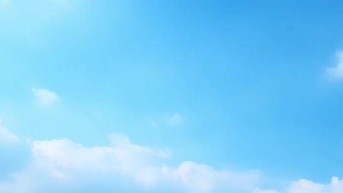 Clouds Drifting Across a Vivid Blue Sky