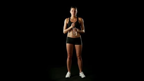 Athletic Woman Drinks Water After Workout